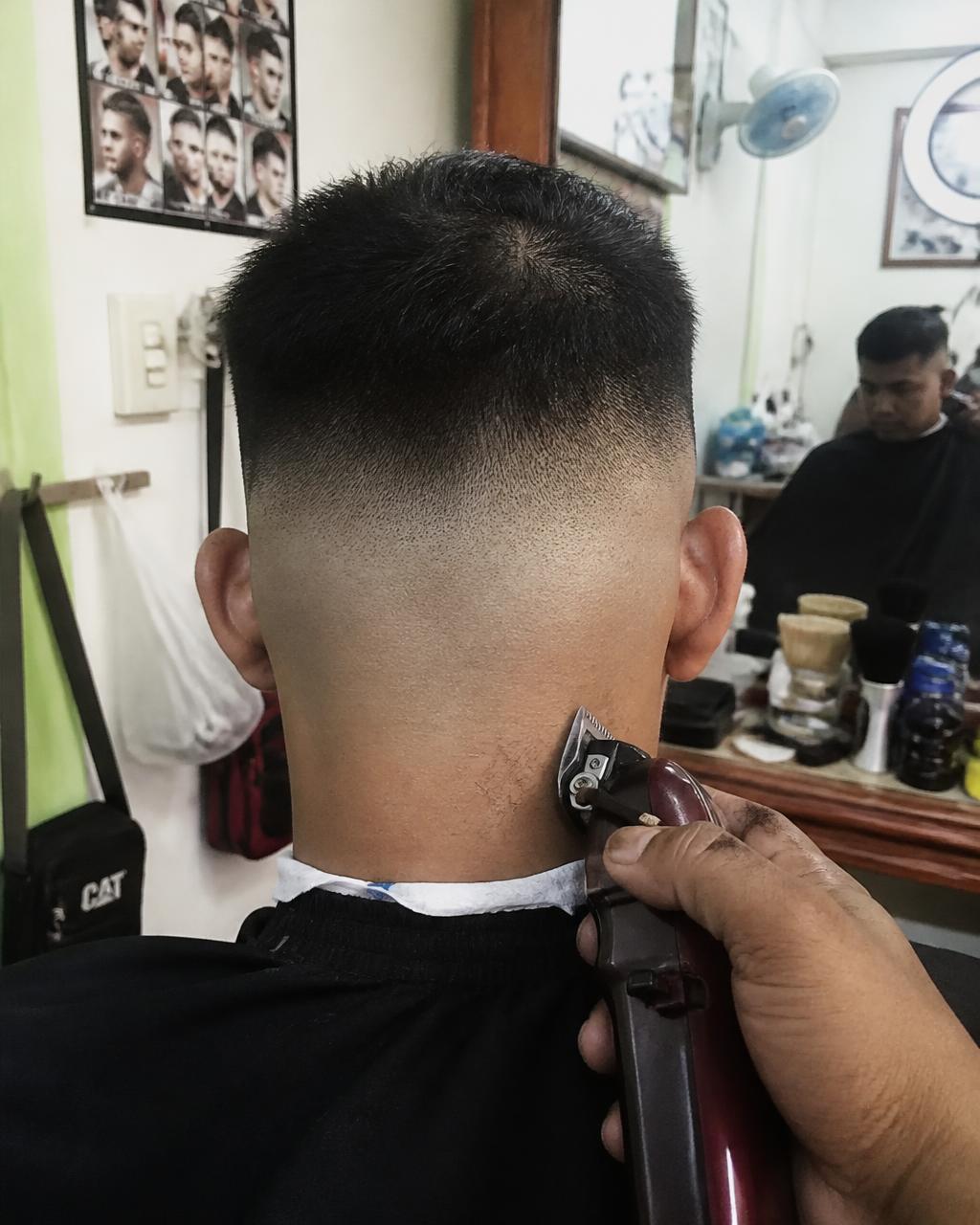 Skin fade taken down clean at the neckline at GC Miami Barbers