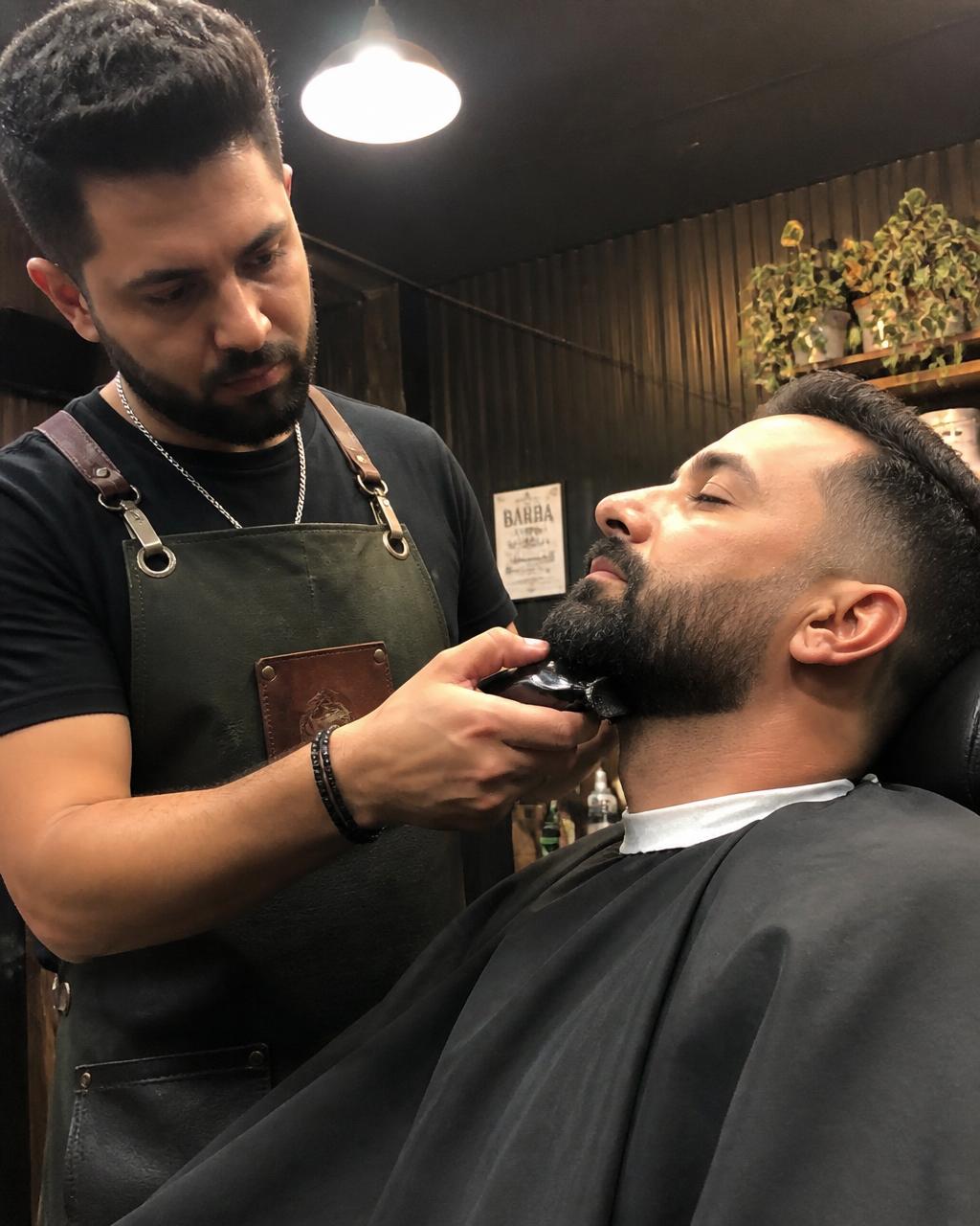 Beard trim shaped up with a trimmer at GC Miami Barbers