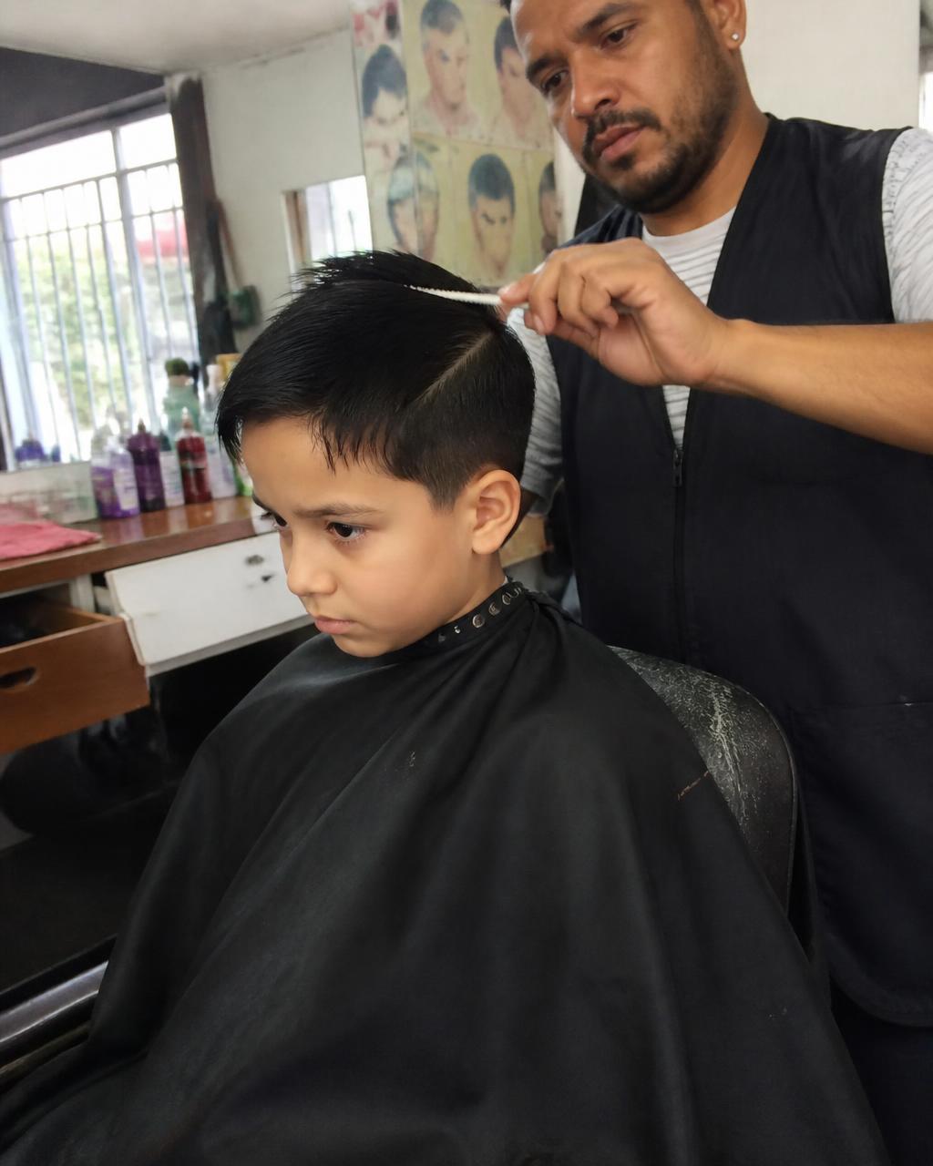 Kids haircut in the chair at GC Miami Barbers at GC Miami Barbers